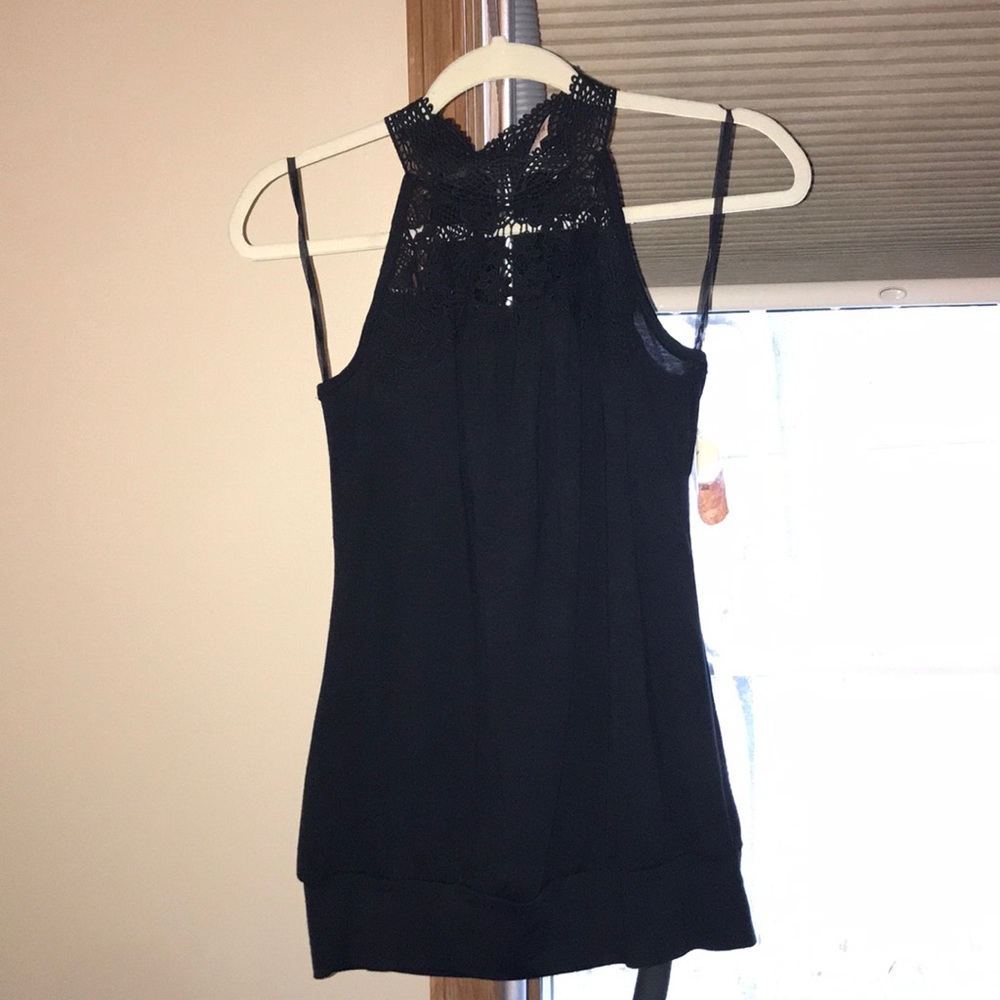Black crochet at the neck tank